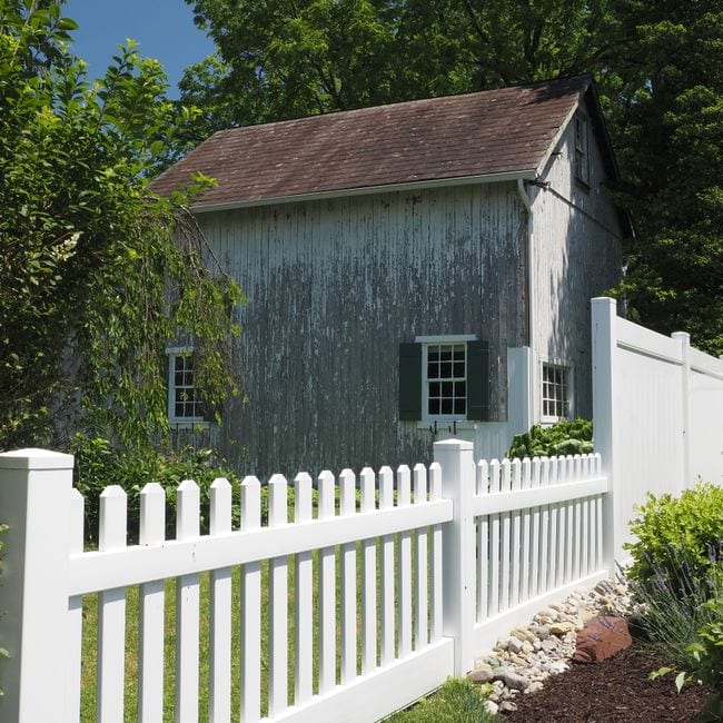 Freshly painted timber fence in a backyard