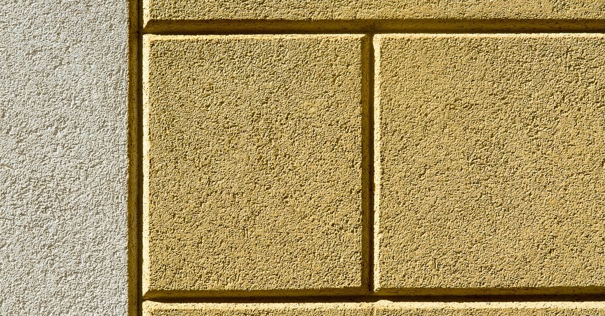 Freshly painted rendered exterior wall with a smooth even finish