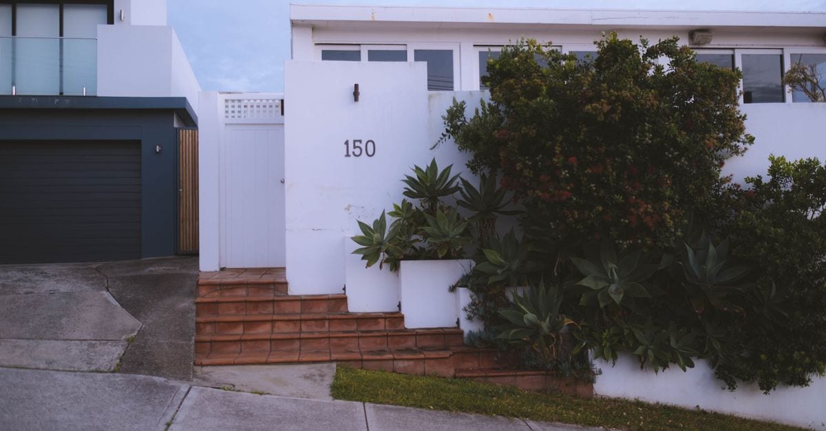 An exterior repaint on a weatherboard home.